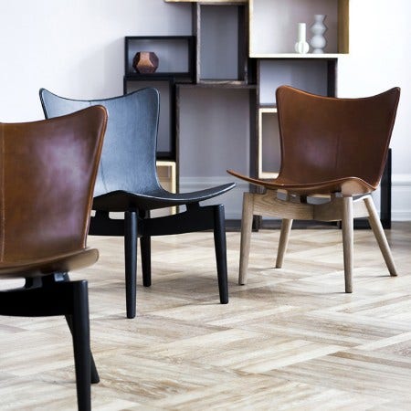 The Mater Shell Chair, designed by Michael Dreebens, represents his ongoing interest in traditional craft practices in North India - in this case saddle making. Available in black or brown saddle leather.