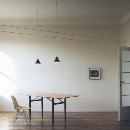 The Flos String Suspension Lamp by Michael Anastassiades, 2014, is a suspension lamp providing diffused light using LEDs.