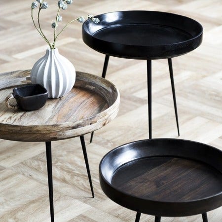 The Mater Bowl Table series, designed by Ayush Kasliwal/ IND, is made of Sustainably harvested natural mango wood with steel legs and is available in 4 sizes and 3 stains: Natural, black and sirka grey.