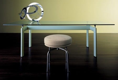 The LC6 Table, shown here with the LC8 Swivel Stool, was first presented to the public at the 1929 Salon d'Automne in Paris, along with other pieces of the LC Collection.  