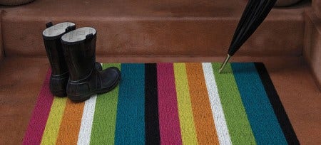 In 2000, she introduced floor mats, place mats and totes made from her propriety woven vinyl. Soft and flexible yet extremely sturdy, the material, which she dubbed  "plynyl," was the result of an intensive research process.
