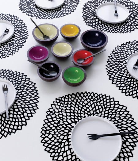 The Chilewich Dahlia Table Mat, with its lace-line openwork, is available in show-stopping metallic colours such as gold, silver and brass, also bright lime green and orange. 