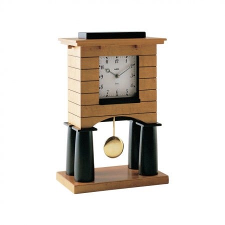 A clock as a work of architecture! Designed in 2013 the Mantel Pendulum Clock in maple-veneered wood has a quartz movement. The Graves Mantel Clock is a small, domestic work of architecture made entirely by hand and it fascinates us with its many construction details. 