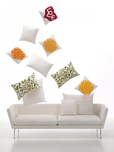 The Vitra Suita Two-Seater Sofa, designed by Antonio Citterio, 2010, takes the classic sofa and gives it a contemporary, lightweight, yet industrial and technical look. The clear lines of the body and the soft-worked paddings seem to float on top of the bridge-like feet made of polished aluminium.