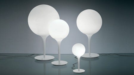 The Castore family of lighting, designed by Michele De Lucchi, 2003, has a spherical diffuser design that is enhanced by a removable-fitting and tapering luminous stem.  