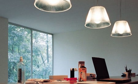 The Romeo Moon Suspension Light, designed by Philippe Starck, 1996. The reeded surface of the diffuser gives an almost metallic look. It is also available as a floor and table light.