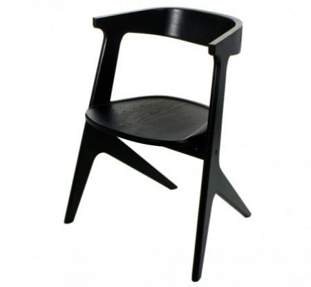 A solid oak chair finished in black or natural coloured lacquer. The Slab Chair was born out of the need for a stack-able, space-saving armchair.