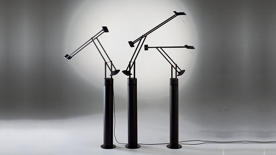 Here shown with its cool floor support that turns it into a floor light, the Tizio Classic, designed by Richard Sapper, 1972, is available as a Tizio Micro, Tizio 35, Tizio Classic and Tizio Plus. 