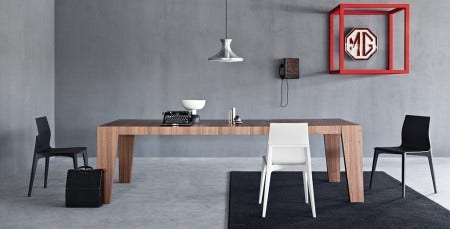 The Pianca Caragena Dining Table is available in two sizes with walnut or burnt oak finishes. The top is  "staved" so it is in long running sections.