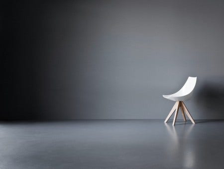 The high gloss white seat of the Pianca Gamma Chair is perfect for a dining chair or an occasional chair.