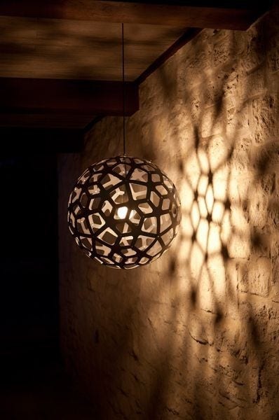 The David Trubridge Coral Pendant Light's form is based on the structure of a geometric polyhedron. Every piece is identical, making home assembly easy. The way it grows outwards with fingers reminds David of snorkeling over reefs, exploring all the various coral shapes. There are 13 color options available and 6 sizes.