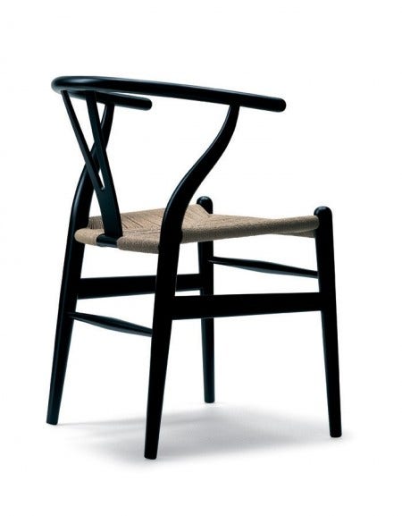 The Carl Hansen Wishbone Chair, designed by Hans J. Wegner in 1949, is perhaps Wegner's most celebrated work. A light, attractive and comfortable dining chair with the characteristic Y-shaped back and hand-woven seat.