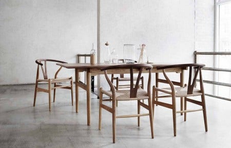 The Carl Hansen CH327 Dining Table was designed in 1962 by Hans J Wegner. The solid wood tabletop is made from hardwood staves that run the full length of the table, giving it a harmonious surface. The table is available in two sizes, 5 wood options and has a leaf option for all those extra people.