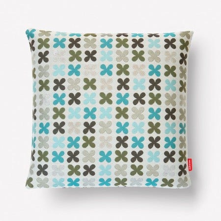 The Maharam Quatrefoil Pillow created by Alexander Girard in 1954, echoing and abstracting a floral motif used as architectural ornamentation.