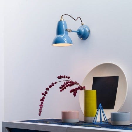 All the Anglepoise Lamp types offer wall sconce editions. The base has a built-in switch for ease of use and the flexible shade can be rotated to direct just the right amount of light where needed. Lots of color options depending on the edition.