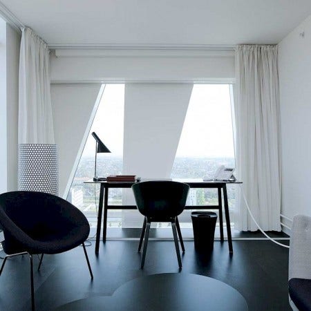 The Louis Poulsen AJ Table Light fixture, designed by architect Arne Jacobsen, emits downward directed task light. The angle of the shade can be adjusted to optimize light distribution. The shade is painted white on the inside to ensure a soft comfortable light. Available in eight colors. Also available in floor and wall sconce models.