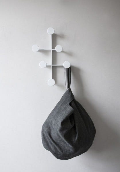 Menu Knot Bag: A sturdy cotton storage bag. Slide one handle through the other and hang on a chair, knob, or hook. Bag is reversible, letting you show off it's light or dark side.