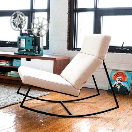 The Gus* version of the perfect modern rocking chair; featuring a black powder coated frame with architecturally-styled cushions inspired by airport lounge seating and 70's car interiors. Available in foour custom upholstery colours.