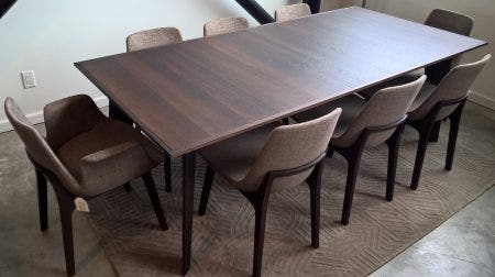 A Poliform Howard Table with Ventura Chairs (6 armless, 2 with arms). The complete set was regularly priced at $18,523, it is on sale for $10,995.