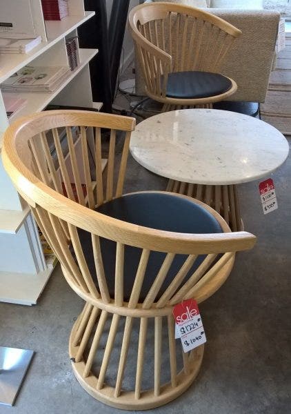 Two Tom Dixon Fan Chairs in Natural Oak with black leather seats, Reg. $1224, sale price $1040. Also a Tom Dixon Fan Base Screw Top Table in Marble, Reg. $1100, on sale for $935.