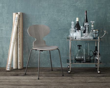 The Fritz Hansen Ant Chair has sold in the millions and is considered a classic today. It consists of two simple elements: tubular steel legs and a springy seat and back formed out of a continuous piece of plywood in a range of vivid colors.