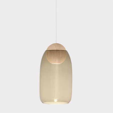 The Mater Liuku Collection of pendant lamps is a contemporary pendant lamp designed by Finnish designer Maija Puoskari. Liuku is consisting of a coloured mouth-blown glass shade nestling over an FSC-certified alder wood base in two different shapes, with long-life LED built in. Liuku’s shade is available with clear glass or in two beautiful tones of smoke or gradient violet. Additionally, the wooden base can be used on it’s own as a single pendant, or to create a rows and clusters for both residential.