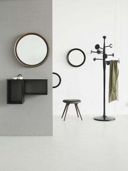 The Mater Trumpet Coat Stand, designed by the Danish architect duo Space Copenhagen, has nine discs in three different sizes that are positioned at angles suitable for hanging hats, scarves and umbrellas. Available in black or aluminum finish, made of recycled aluminum.