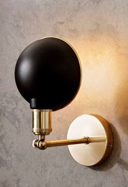 The Menu Walker Wall Lamp was designed by Søren Rose, based on a trip he took to the Tribeca area in New York City, searching for beautiful old lamps. He used this inspiration to design lamps for The Silo, an urban revitalization scheme in Copenhagen.