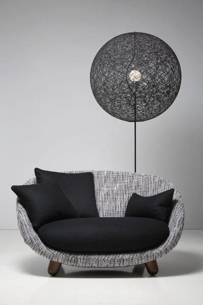 Designed by Bertjan Pot and introduced in the Moooi collection in 2002, the Random Light has become a best seller right from the beginning. It transmit a feeling of simplicity, softness , lightness and a touch of magic in contemporary style. The production process is a special story by itself: a resin drained yarn is randomly coiled around an inflatable beach ball creating a translucent 3D fabric. The beach ball is then deflated and extracted from a round opening in the lamp. At the end the skin becomes the product. Soft and magic.