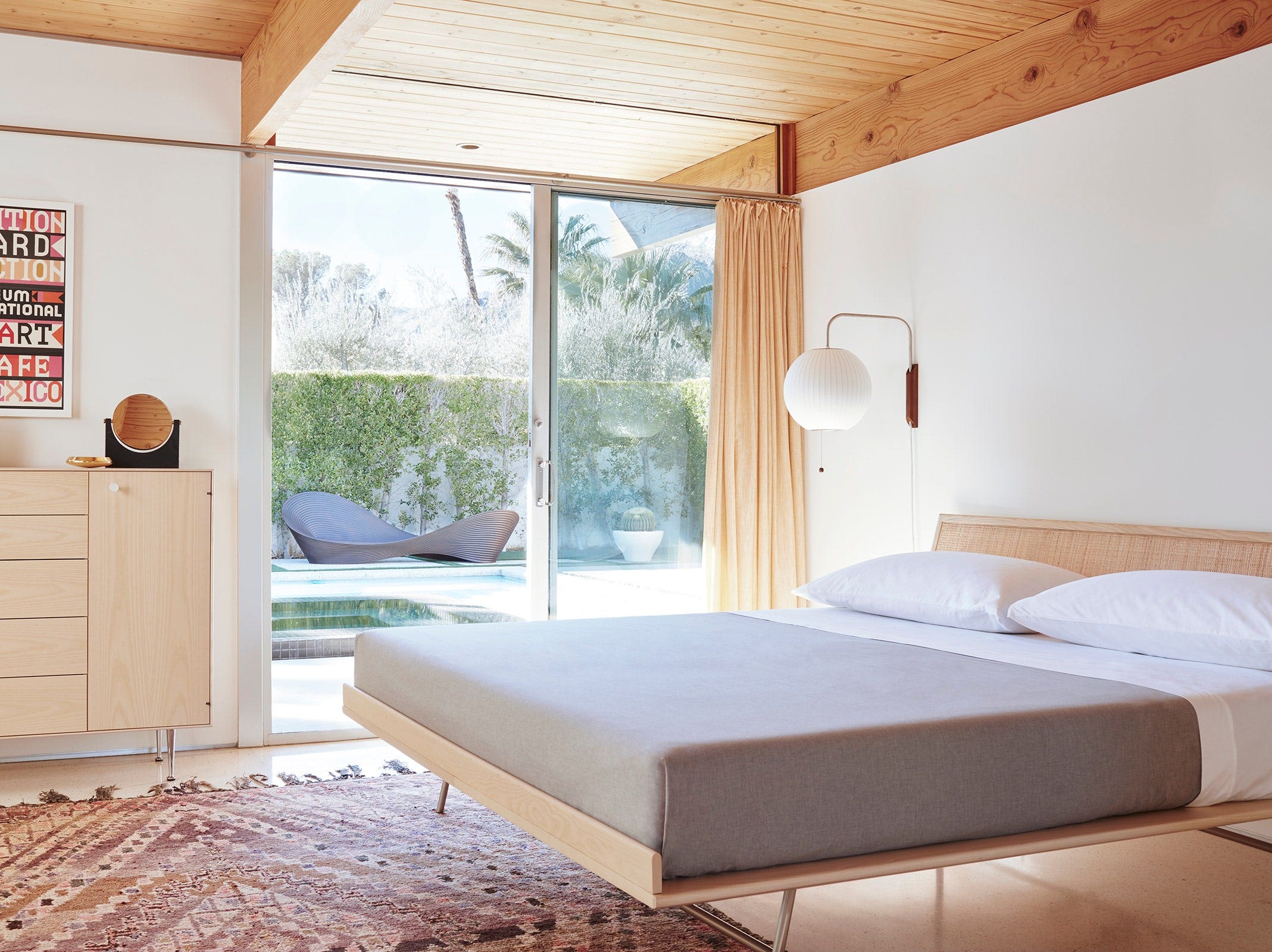 Nelson Thin Edge Bed and Chest Cabinet in white ash in a mid-century modern bedroom
